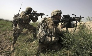 US Army soldiers return fire during a gun battle with suspected Taliban militants near the village of Jilga