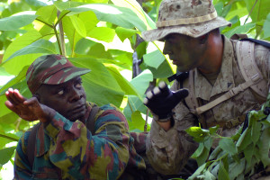 BEMBEREKE, Benin (June 14th 2009) - Scout Lance Cpl. Thomas J. Bourgeois receives observational information from Beninese Army officer Mathieu Ahodoto during a joint U.S.-Benin scout observation training conducted June 14 as part of Exercise SHARED ACCORD 2009.  Exercise SHARED ACCORD is a U.S. Africa Command-sponsored, U.S. Marine Corps Forces Africa-planned exercise that supports U.S. Africa Commands Theater Strategic Objectives. The exercise is scheduled to conclude on June 25. (Official Marine Corps photo by Lance Cpl. Jad Sleiman)