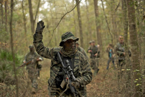 A member of the North Florida Survival Group carries an AR-15 rifle as he takes the point position in performing enemy contact drills during a field training exercise in Old Town, Florida, December 8, 2012. The group trains children and adults alike to handle weapons and survive in the wild. The group passionately supports the right of U.S. citizens to bear arms and its website states that it aims to teach "patriots to survive in order to protect and defend our Constitution against all enemy threats".            Picture taken December 8, 2013.   REUTERS/Brian Blanco  (UNITED STATES - Tags: SOCIETY POLITICS)    ATTENTION EDITORS: PICTURE 11 OF 20 FOR PACKAGE 'TRAINING CHILD SURVIVALISTS'  SEARCH 'FLORIDA SURVIVAL' FOR ALL IMAGES ORG XMIT: PXP11