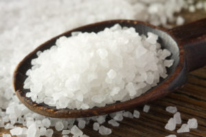 Sea salt on wooden spoon